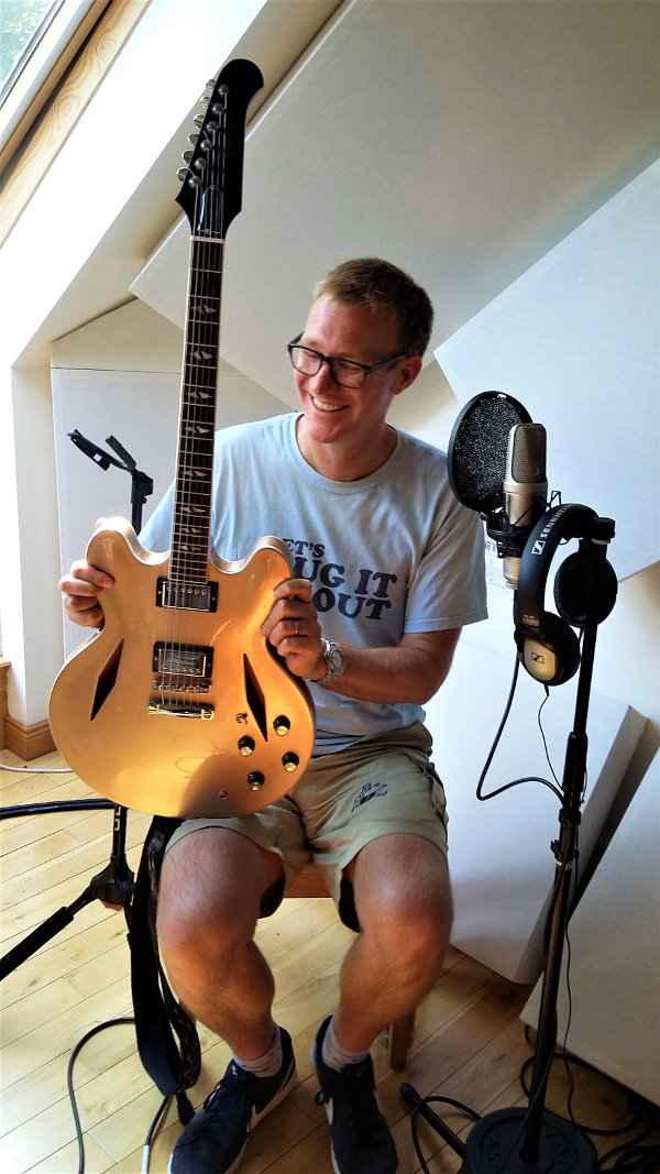 Alastair Creyke recording vocals and guitar at Jennifer Clark's studio