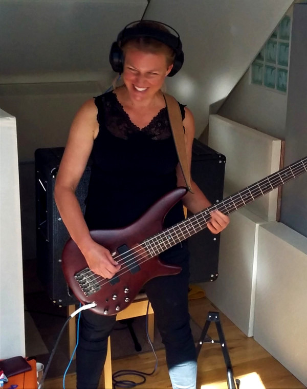 Liz Morrison recording bass and vocals at Jennifer Clark's studio