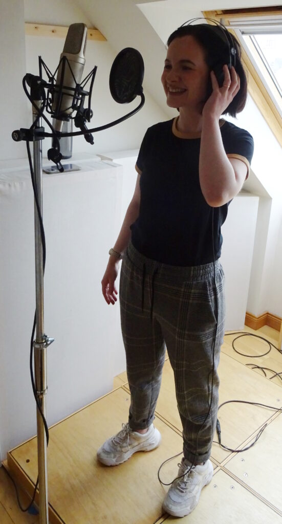 Stefanie Lawrence recording vocals at Jennifer Clark's studio